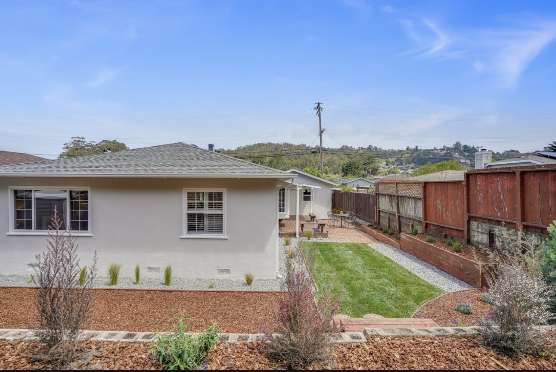 Existing full rear elevation, garden, patio, fence, windows, and roofline